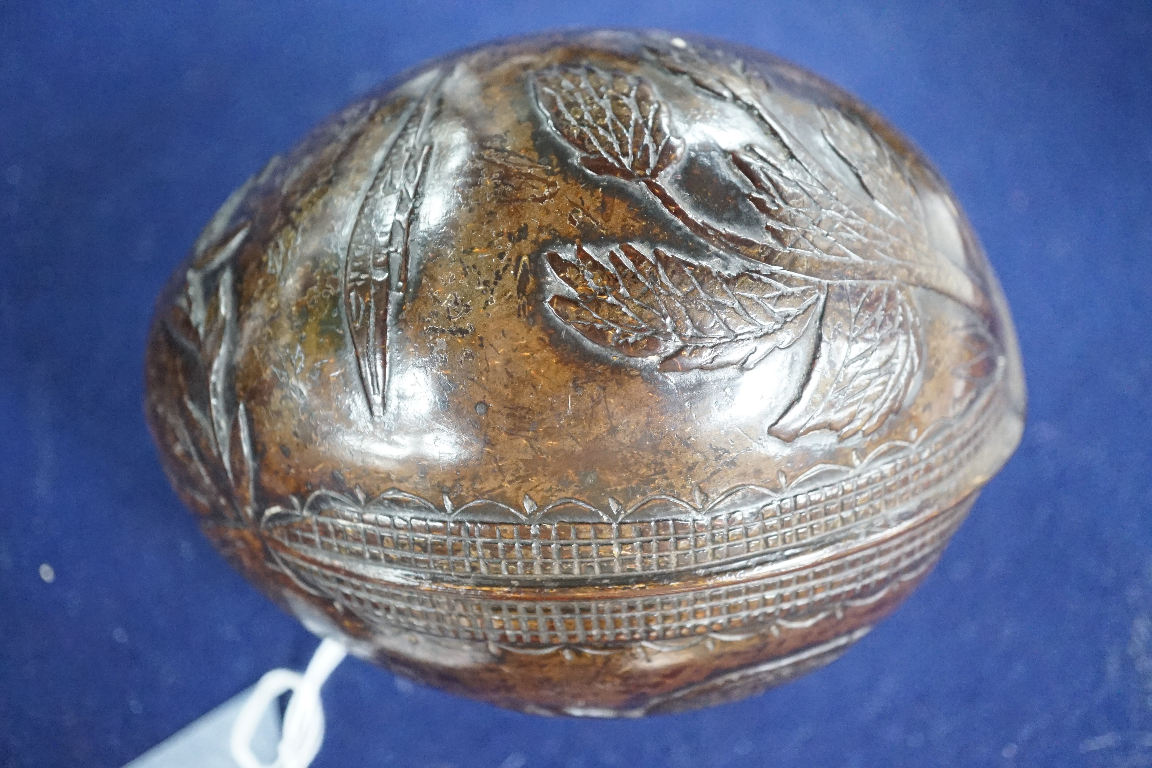 A 19th century carved coconut, 14 cm